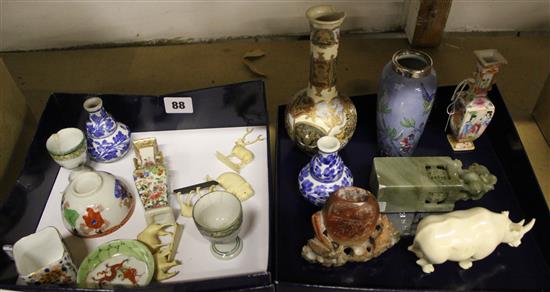 Collection of miniature Oriental pots and carvings